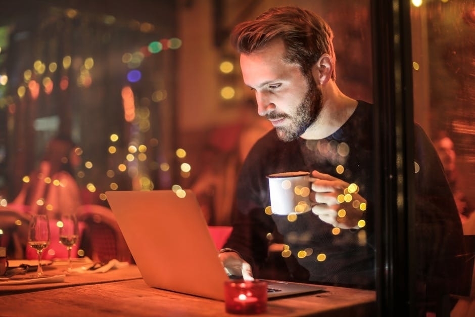 man at computer at night