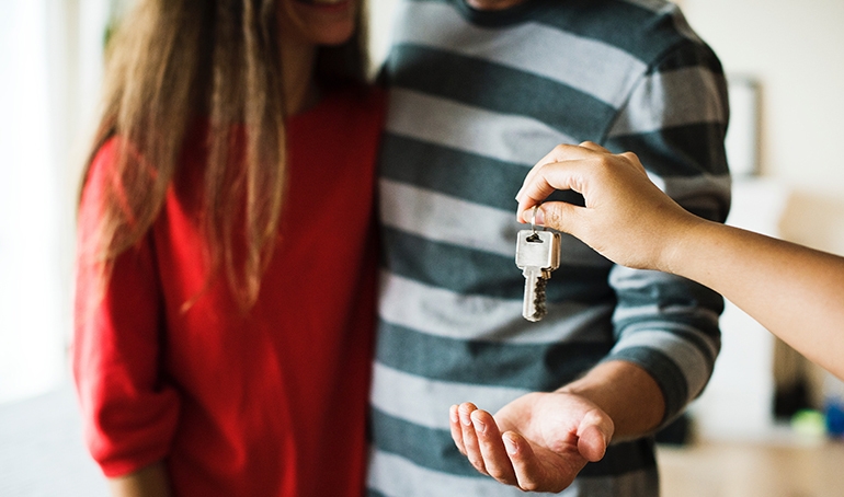 couple being handed keys